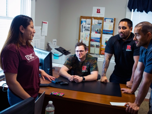 veteran Rutgers students talking at table